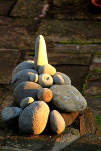 With the sun low in the sky as winter drew on much of the garden was in shade but towards sunset it lit up features including this construction of limestone pebbles and fossils.