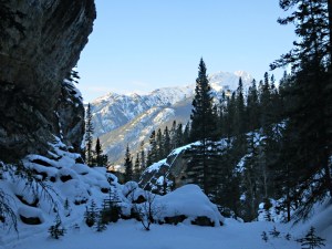 Approaching the steep drop on the way back down, sunlit cascade Mountain in the background