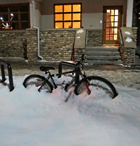 Bicycles half buried in snow are scattered around the town for weeks on end