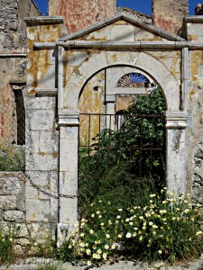 Built in the 19th Century, derelict since damage in WW2, today brightened by floral threshold