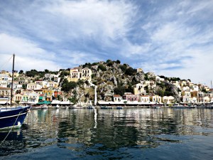 Flat calm sea, peace and quiet in Yialos, the main harbour on Symi, stark contrast with the yachts and gin palaces crammed in during the summer.