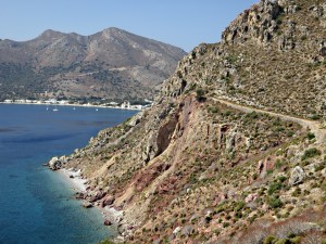 Looking back at the weak, shaley band and the tiny beaches far below