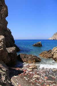 Secluded beaches on the uninhabited west coast are flanked by steep cliffs,providing nesting sites for Eleanora's Falcons