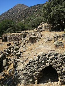 A cluster of ancient houses underneath the agricultural terraces