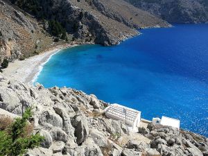 Looking down to the tiny cliff-edge monastery of Agios Vasilios with Lapathos Beach below