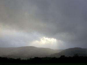 Reaching the ridge-top path a brief respite in the horizontal rain coincided with a brief  gaps in the clouds to the west.