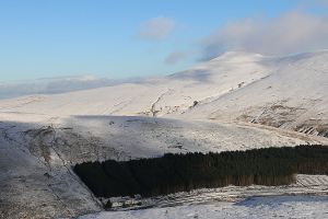 The car park and Storey Arms outdoor activity centre with Corn Du above