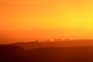 Ridges receding into the golden glow to the west