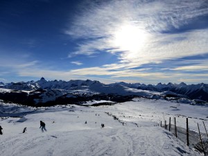 Looking down the ski run over Sunshine Meadows, Mount Assiniboine on the left