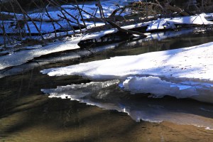 Zooming in on snow-covered ice which collapsed in the thaw as water levels dropped
