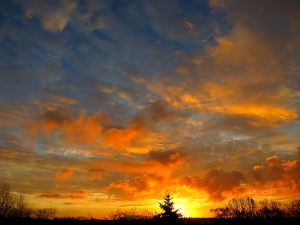 Not an impressionist painting but the fiery sky behind the house