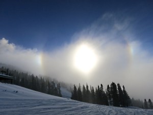 Partial 'icebow' refracted through a band of cloud