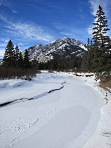 Looking up the now frozen creek towards Mount Norquay