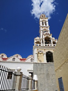 The church towering behind the house