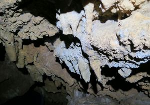 Stalactites coloured probably by the red spoil through which the water would have drained