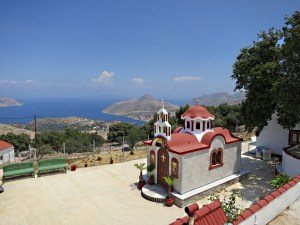 F Looking over the tiny basilica-like church to the harbour far below