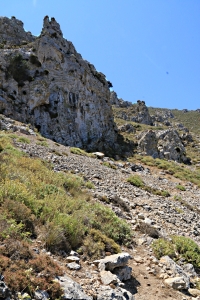 .... and leads across a scree below cliffs
