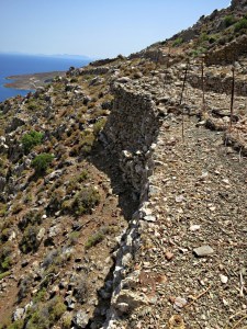 .... before picking a way along the narrow top of a wall