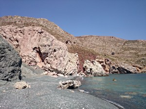 .... and looking back along the beach of 'Green Tholos' to the cliff and its fissure