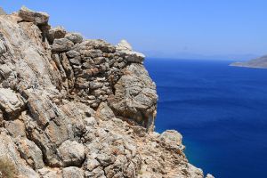Rough-built stone wall fortification set in the top of the crag