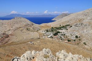 Looking from the fortification across the col  with its agricultural enclosures and building