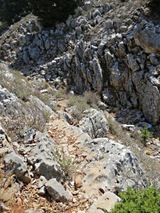 Dropping down sloping slab into the top of the gorge to cross to the other side