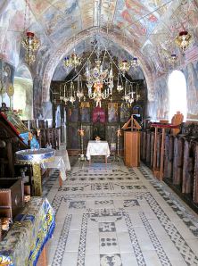 The magnificent inside of the church with hochlakos floor and walls and ceiling covered in frescos 