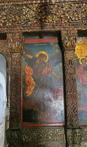 One of the panels in the iconastis, this one depicting the Archangel Michael, edged by fine wood carving