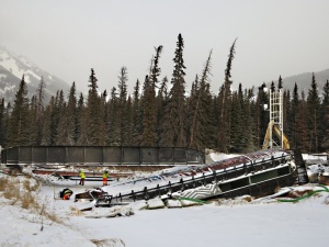 A week after the derailment, temporary bridge in place, river frozen solid enough for work to be carried out from its surface, wagon frozen in place, spillage removed