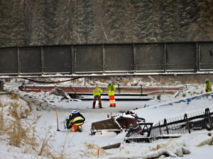 Drilling through the ice with hand auger to monitor the water