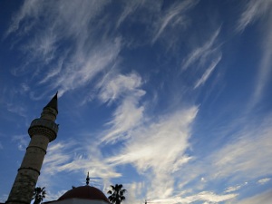 Minaret on old mosque in the agora points to high cirrus cloud