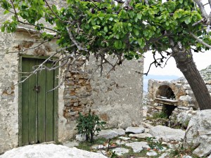 Still-used house with bread oven beyond and shaded by mulberry tree
