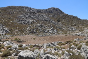 From the lower edge of the enclosure looking down to the flat area at the lowest point of the valley, an area cleared of stones and which floods and collects sediment