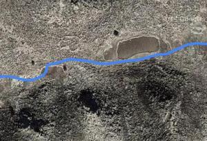 Extract from the tracking software used for the trek, superimposed on satellite image showing the two areas of radically different ground texture and the faint outline of a possible relict settlement (resolution poor because image degraded at source  for ‘security’ reasons