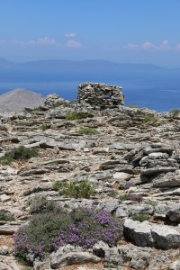 The small, simple structure on a shoulder of the mountain.