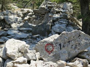 The first of the restored wine presses alongside the path