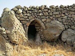 One of the many houses built into rocks alongside the path