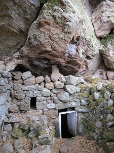The entrance to the subterranean church further along the caldera