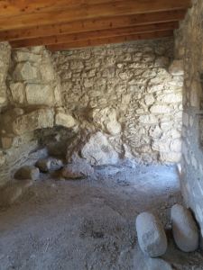 Inside the upstairs family room looking towards the fireplace.  Roof recently replaced to stop further weather damage in winter rains