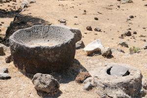 The large bowl of black volcanic rock, the top of the cistern alongside and a prized shard of marble bowl.