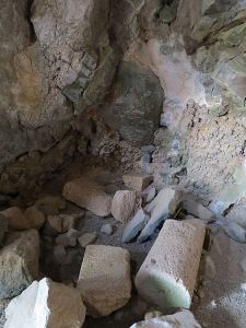 Inside, pieces of dressed and carved stone, things of value being hidden