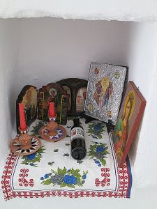 ... and a niche with artefacts, including a half-bottle of wine